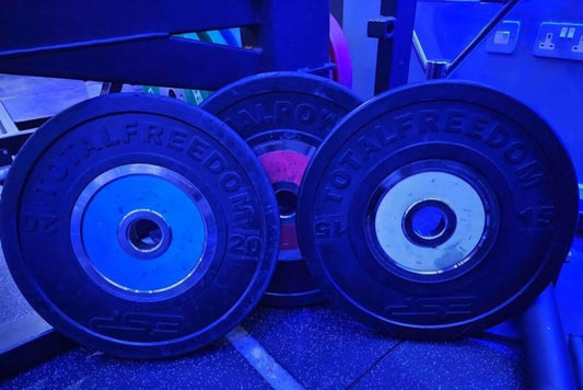 Technogym Bumper Competition Colour coded weight plates with Sandwich racks